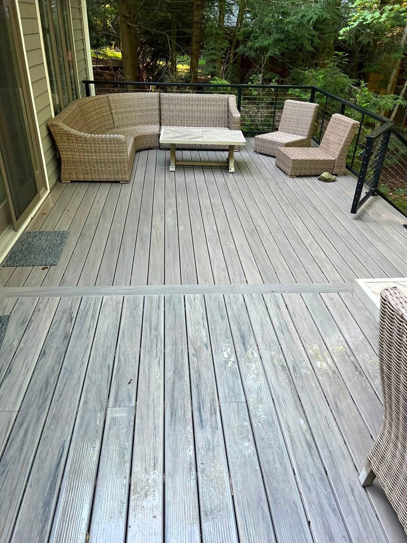 Same wooden deck fully cleaned with furniture in place